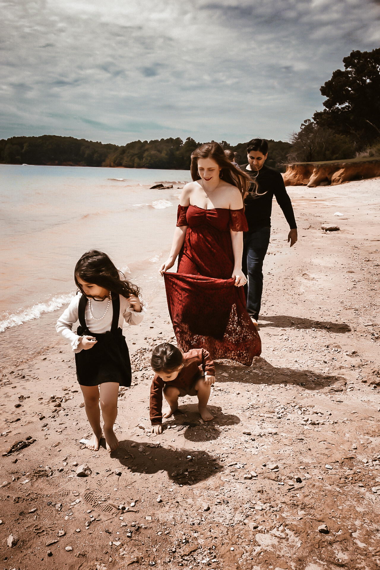 Family of 5 walking on the and at Lake Lanier and looking down a the ground