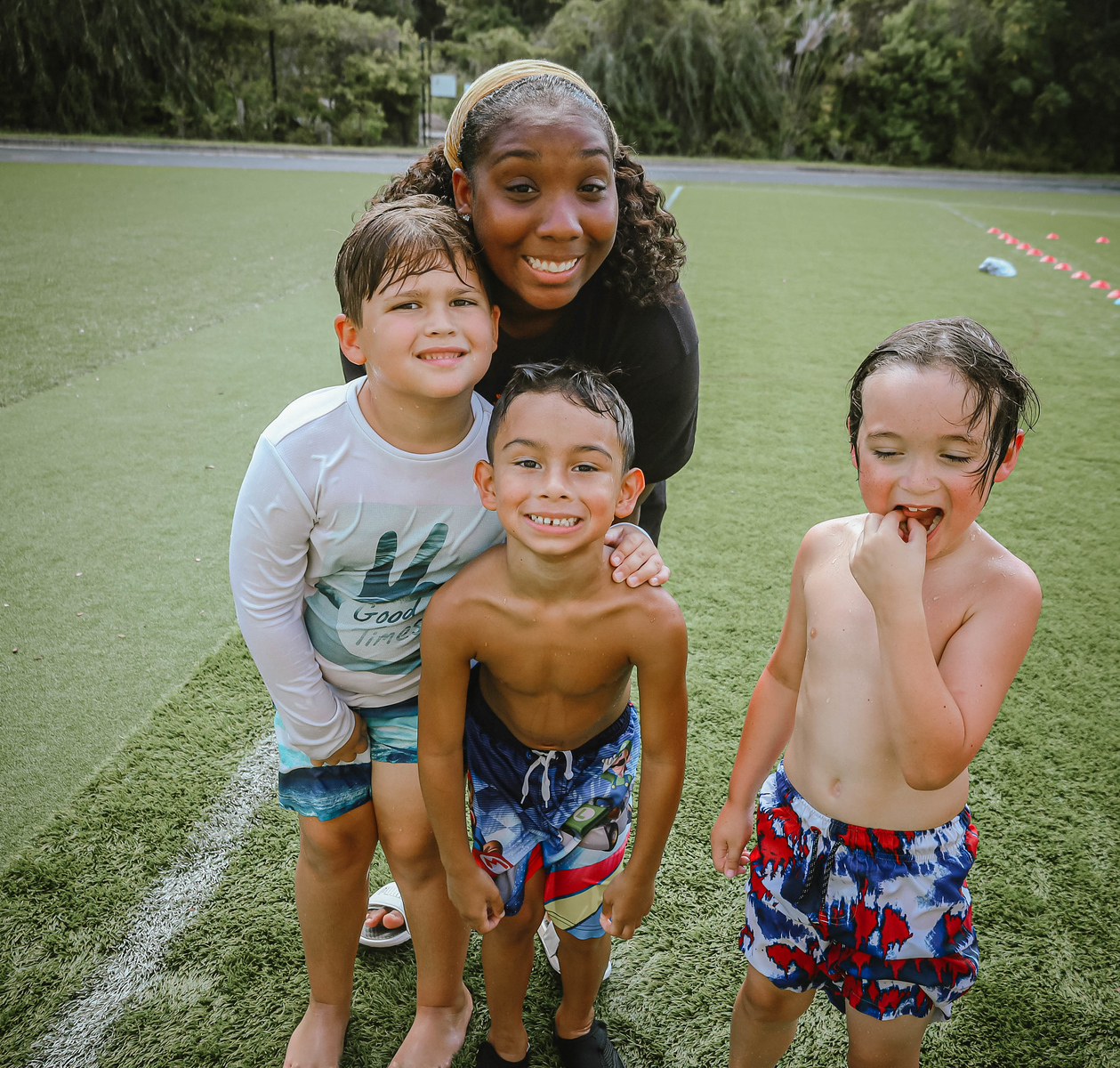 Ashley, owner of Ashley Aria Photography, at woodlands camp, in Cleveland ga, with kids from camp during swim time.