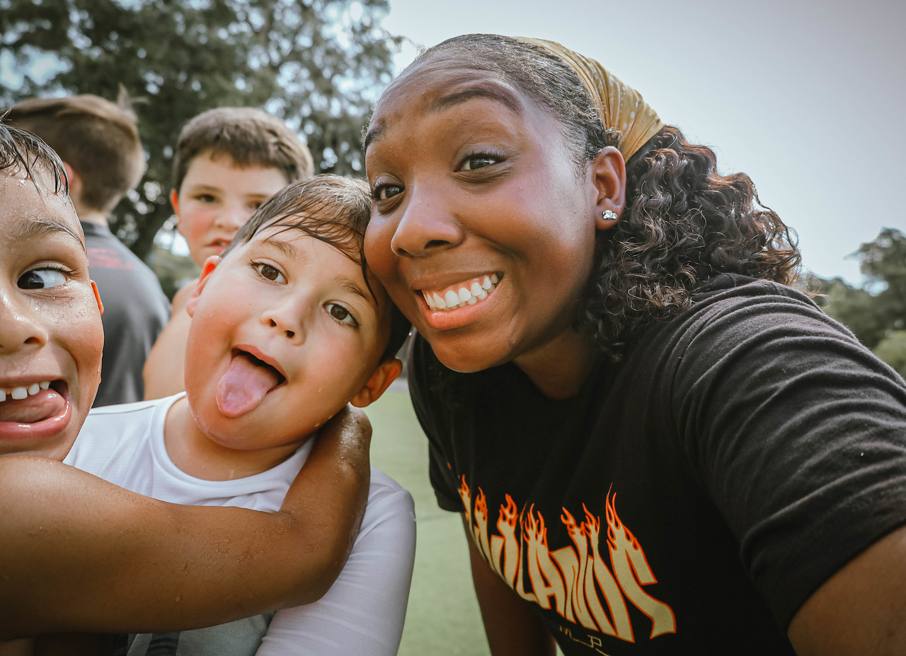 silly portrait/selfie of Ashley Aria with some kids from a summer camp called Woodlands Camp in Cleveland Ga after a water game