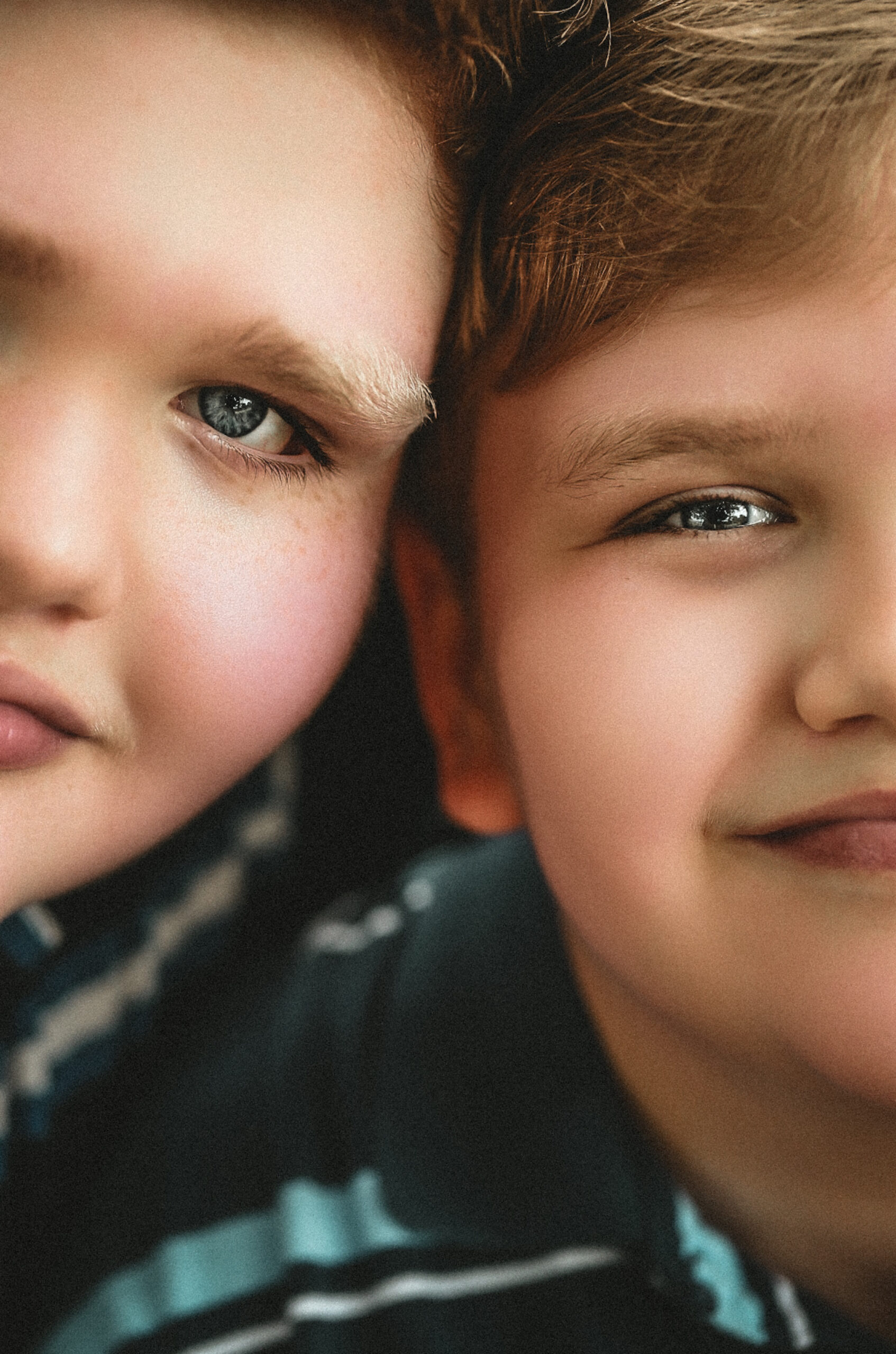 up close detail portrait of two young brothers, highlighting the details in their eyes